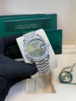 Rolex Day-Date 40 Baguette Diamond Bezel Olive Green Roman Dial President Bracelet 228396TBR German Day Wheel - Image 8
