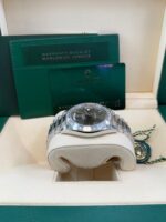 Rolex Day-Date 40 Baguette Diamond Bezel Olive Green Roman Dial President Bracelet 228396TBR German Day Wheel - Image 3